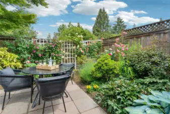 Private patio has established gardens and Japanese maple