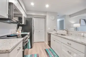 Bright and cheerful kitchen with stainless steel appliances. Also has a nice size pantry perfect for keeping your kitchen organized