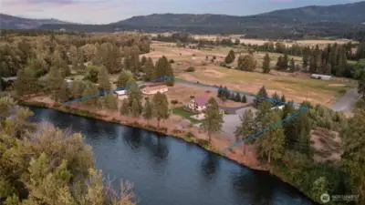 Situated on 2.65 acres, this property offers 407+ feet of rare Yakima river frontage.