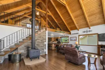 Classic chalet style floorplan features a Cawley 800 wood burning stove with triple lined chimney as the cozy centerpiece of home. In 2024, a new Bosch mini split heat pump was installed in 2024 offering both primary heating and cooling.