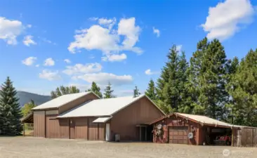 Shop near the main home is 40x60 with 480 sft carport. Additional 24x24 garage with carports on both sides.