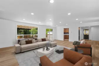 Virtually staged. A large picture window fills the living space with natural light.