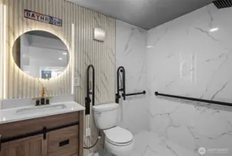 Fully renovated bathrooms with sleek quartz-topped vanities.