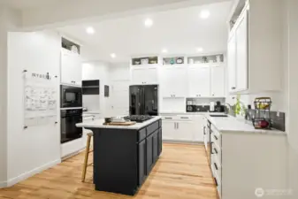 Updated kitchen with luxurious slab marble countertops.