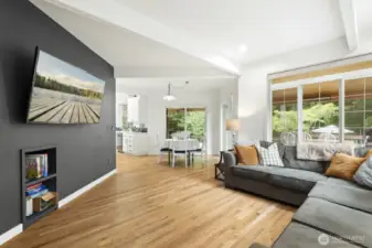 With hardwood floors and brick surround fireplace.