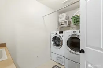 Laundry room with a sink conveniently located upstairs.