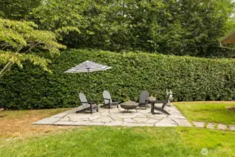 A flagstone patio in the yard to enjoy sunny afternoons.