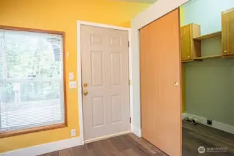 Door from Kitchen to garage.  Laundry room/closet to the right