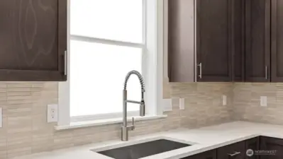 Stainless single sink with designer Moen faucet