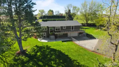 The park-like grounds are tidily landscaped and feature beautiful shade trees and an app-controlled smart sprinkler system.