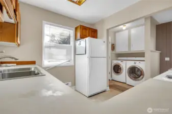 Convenient flow to utility room and backyard access.
