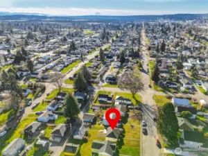 Expanded neighborhood aerial illustrating proximity to downtown amenities.