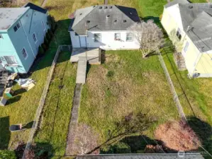 Rear property layout from above, showcasing yard space and access points.