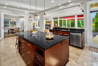 The Kitchen is the heart of the home and open to the formal dining room, informal dining room, living room, and a door straight out to the deck