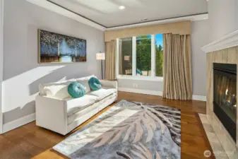 Primary retreat sitting area with fireplace
