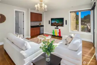 Second floor large flex space has a wet bar and opens to the roof rooftop deck