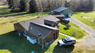 This aerial photo of the front of the house shows the location of the storage shed and shop.