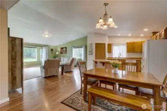 You enter the home to vaulted ceilings and dining/kitchen/living space bathed in natural light.