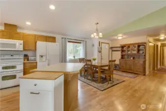 The hallway on the right of this photo provides access to the 3 bedrooms, 2 bathrooms, laundry/mud room, and the attached garage.