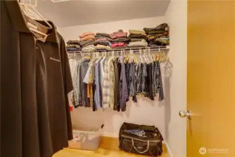 Walk-in closet of primary bedroom.