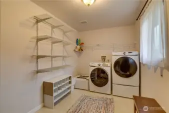 Convenient laundry and mud room. Entrance to attached garage is to the right (not shown).