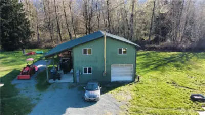 An aerial view of the 2-story shop and RV parking space.