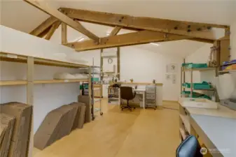 The loft has been partially divided into 3 work areas.