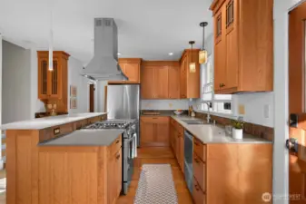 Special touches include a hidden pull out spice rack that is integrated into the column detailing on the island located on the other side of the range