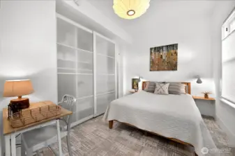 This is the main floor bedroom which is perfect for guests or anyone with mobility issues; you will find additional storage beyond the wardrobe as well