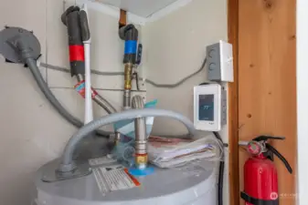 In the Primary Bath Closet is the Hot Water Heater and the controls for the Radiant Heating of the Flooring. The owner has it timed for convenience. But, he is happy to help if there are ANY questions!