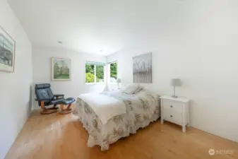 Upper floor guest bedroom with maple hardwood floors.  Winter views of the Cascade Mountains.