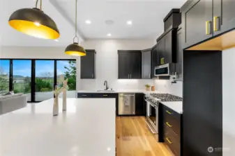 Even the kitchen embraces the breathtaking views. Such fabulous finishes and easy access to infinity deck for outdoor entertaining.