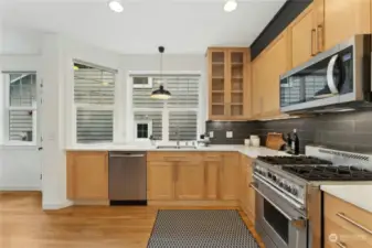 The renovated modern kitchen with a professional propane range.