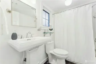 The main floor bathroom with updated fixtures and a tub/shower combo.