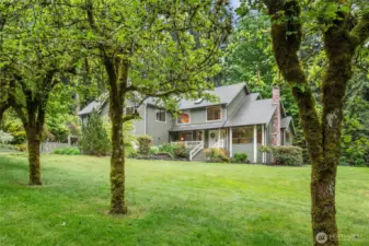 Picture perfect with bountiful fruit trees to enjoy all summer long.