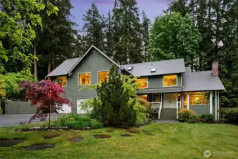 Gorgeous Hollywood Hill custom home nestled down a tree lined lane.