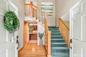 Come on in! Real hardwood floors greet you. Dual staircases in the home.