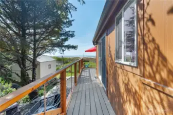 Custom deck wraps around side of home