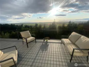 Over 1,000 square feet of decking on two levels and a staircase down to the ground from the lower level and parking area.