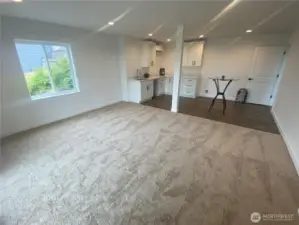 Spacious view apartment type area that’s about 15 feet wide by 25 feet deep.  There’s lots of useful options for your extended family or guests here.