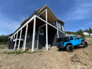 The builder is considering bringing in more fill dirt to allow for cars to more easily turn around here.