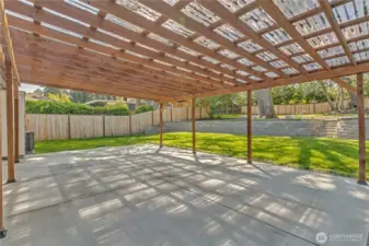 Massive covered patio leads to green grass