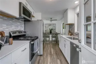 Beautiful kitchen littered with upgrades and quartz countertops