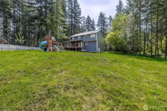 The huge backyard has plenty of room for all your games, gardening and outdoor desires.