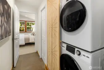 Convenient laundry off of primary bedroom and kitchen