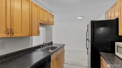 The galley style kitchen has plenty of storage.