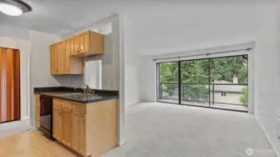Another view from the dining room towards the kitchen and living room.