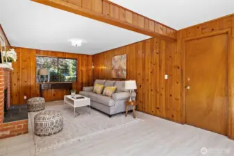 Inviting Family Room  This warm and welcoming family room features a cozy fireplace, generous closet space, and an open layout perfect for everyday living or entertaining.