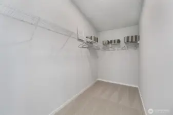 oversized walk-in closet in primary bedroom