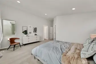 stunning primary bedroom with vaulted ceilings